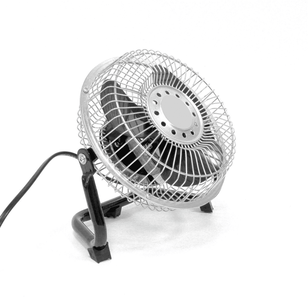 Metal desk fan on white background