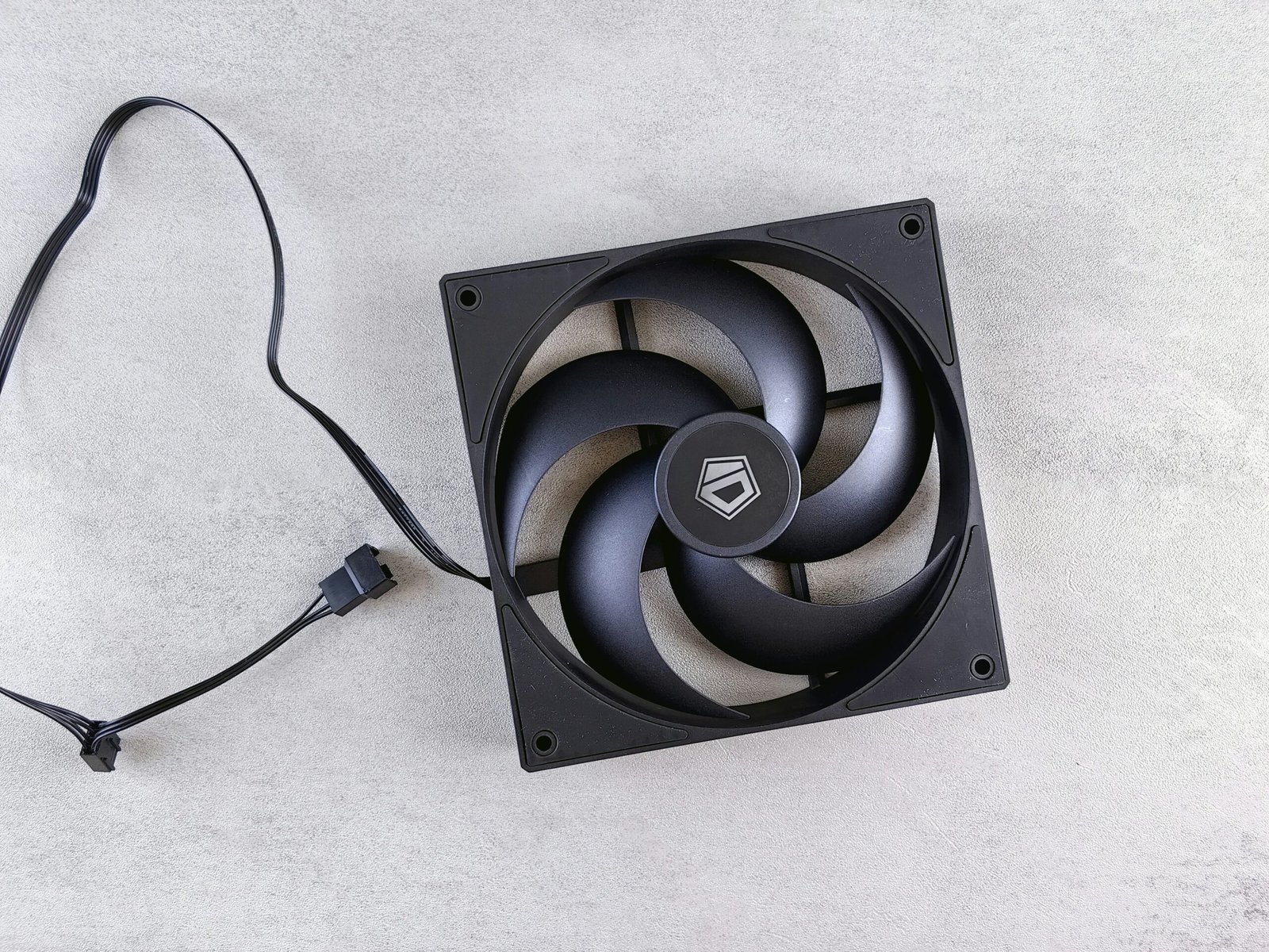 Black computer fan on gray surface
